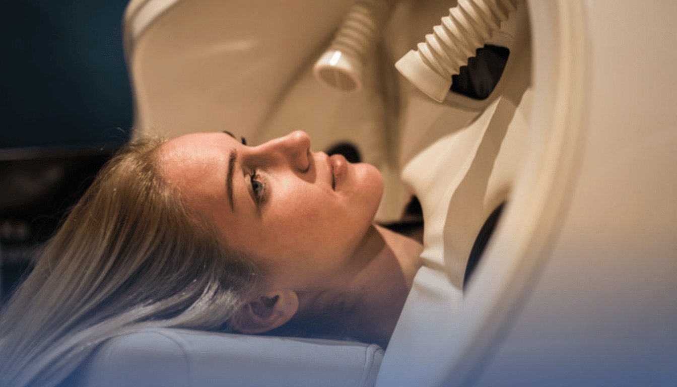 Patient resting inside a hyperbaric oxygen chamber during a monitored HBOT session